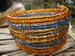 armband glaskraaltjes oranje/blauwgrijs 